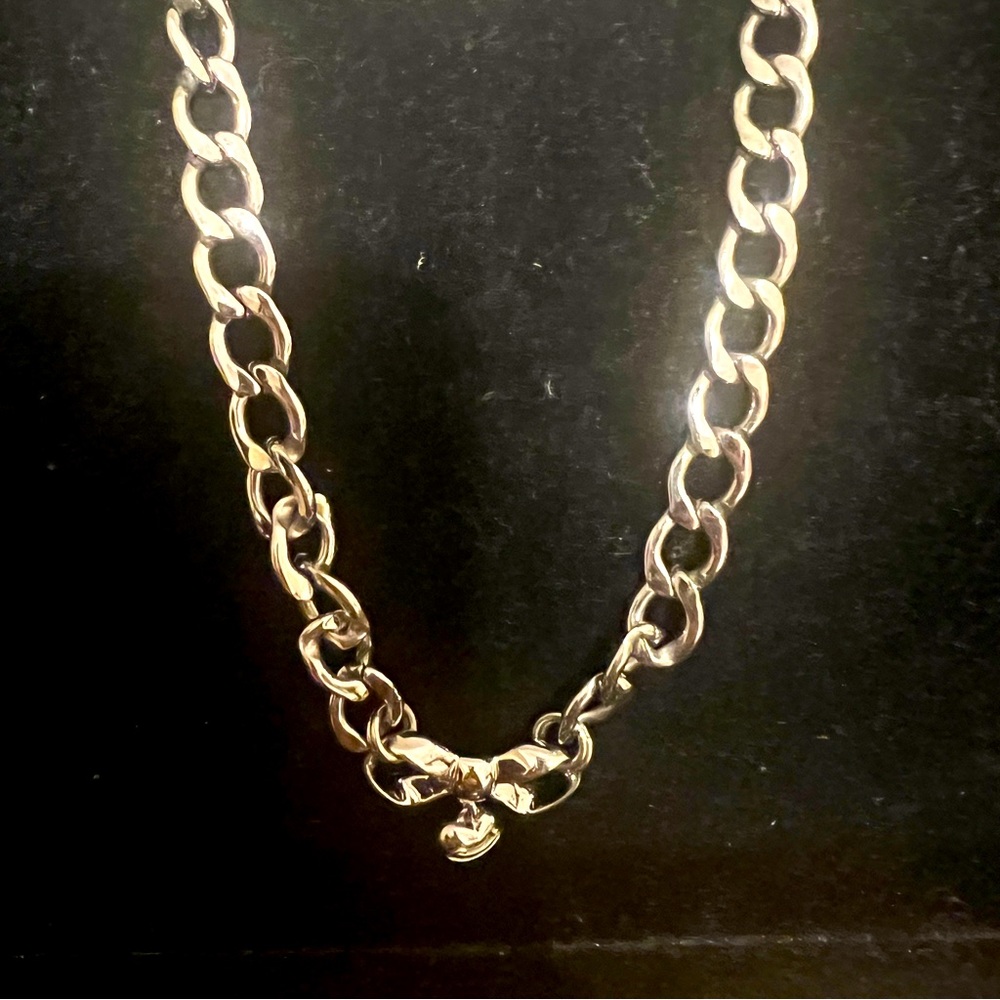 Juicy Couture Vintage silver plating on brass rhinestone bow.